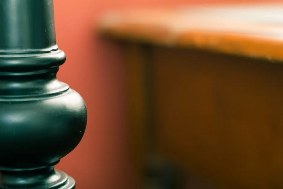 Elegant close-up of a black ceramic object with blurred background for artistic effect.