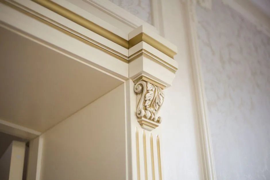 Elegant close-up of ornamental molding in a classic interior design setting.