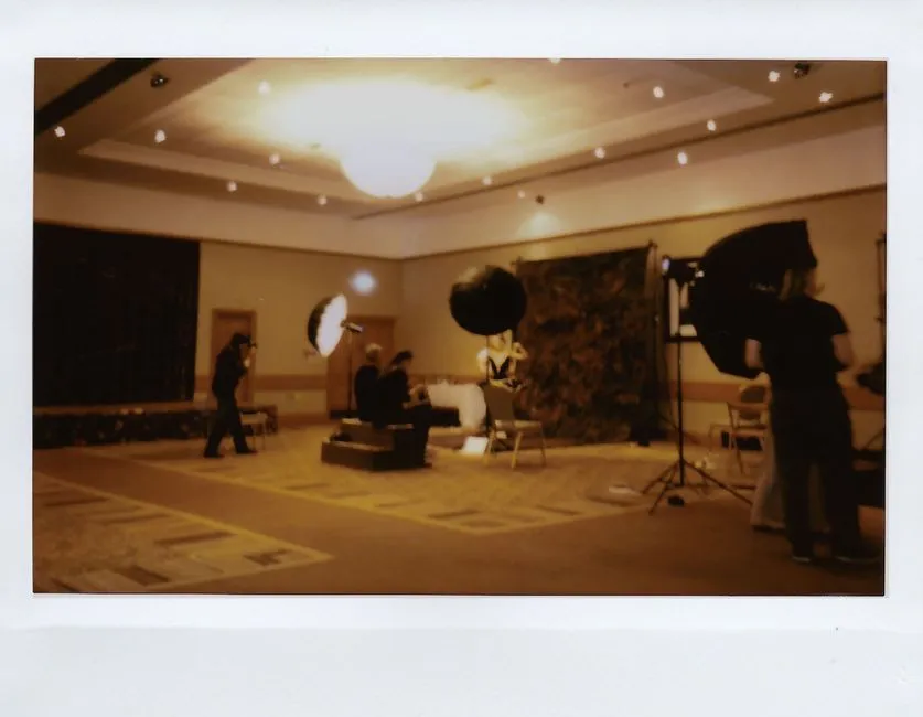 Indoor studio setup with professional lighting and crew at work. Ideal for creative projects.
