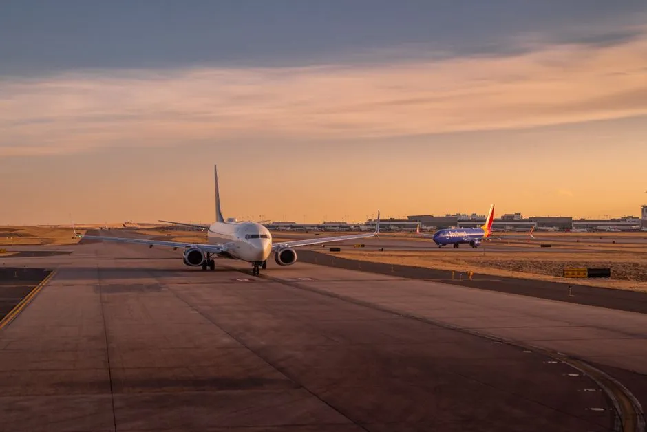 Airplanes on the runway at sunset, ready for departure and takeoff.