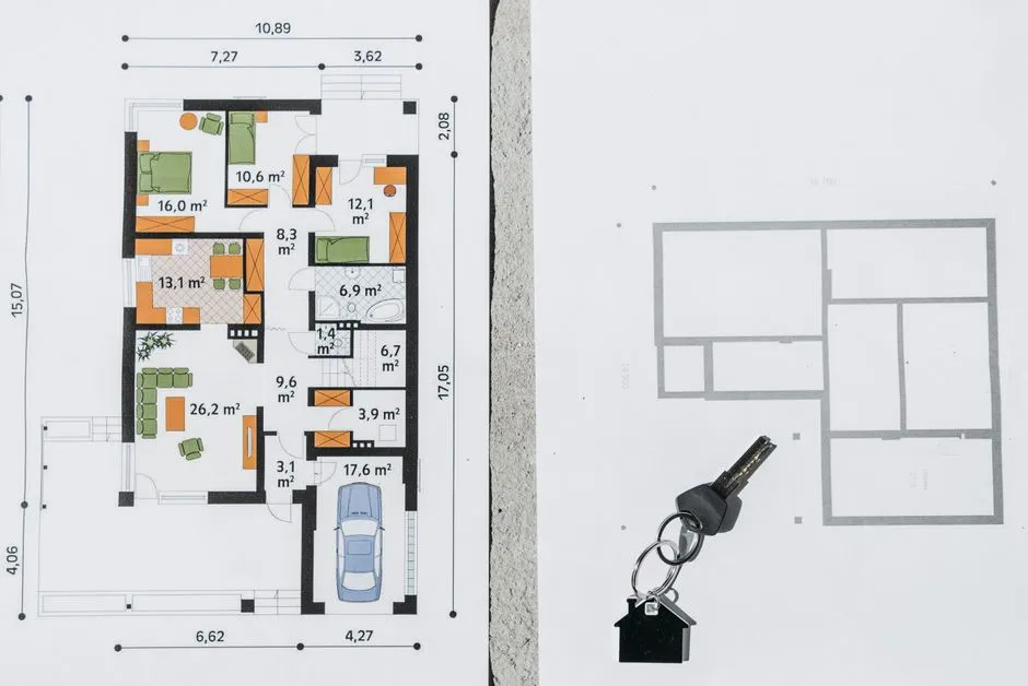 A comprehensive floor plan layout featuring a house key symbolizing real estate and homeownership.